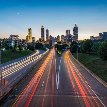 time lapse of car lights on a highway