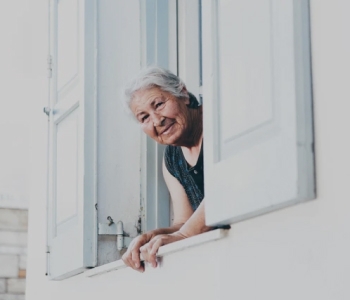 woman looking out from window