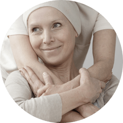 woman with cancer hugging caregiver