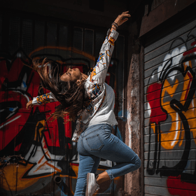 woman dancing in an alley