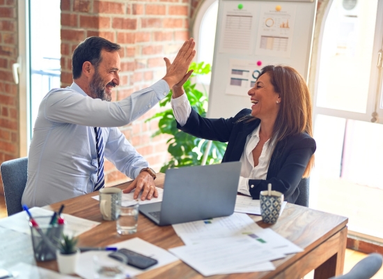 coworkers giving each other a high-five